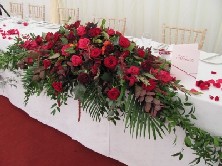 Red hot head table arrangement